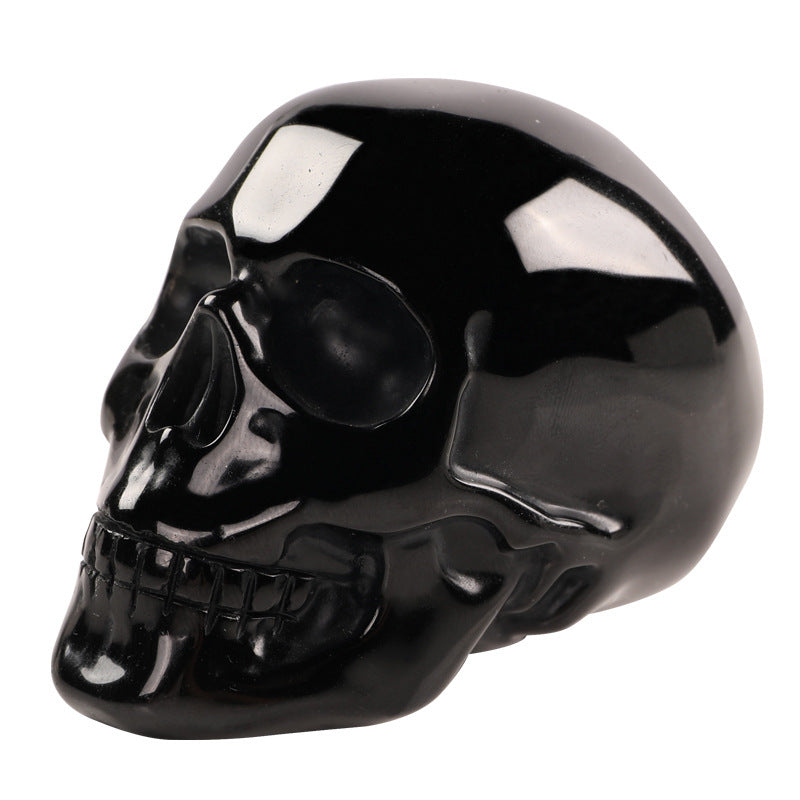 Handgefertigter Obsidian Kristallschädel aus echtem Obsidianstein in glänzendem Schwarz