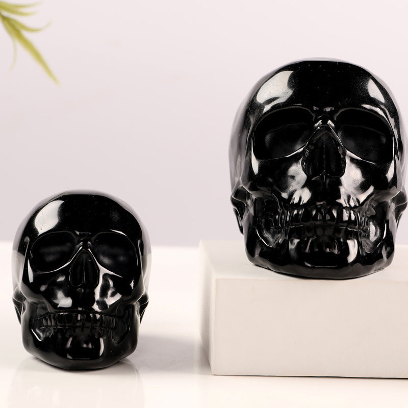 Handgefertigter Obsidian Kristallschädel - Deko und Sammlerstück aus poliertem Obsidianstein.